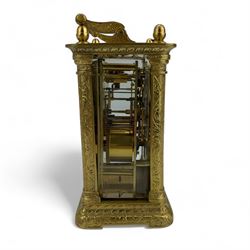 Auguste of Paris - mid-19th century carriage clock in a foliate engraved case with acorn finials and conforming carrying handle, white enamel dial with makers name, Roman numerals, minute track and fine matching steel moon hands,  engraved rear door revealing a twin train going barrel movement striking the hours and half hours on a bell, with the original jewelled lever platform escapement and repeat function, back plate stamped Auguste-Paris, 