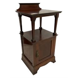 Edwardian inlaid mahogany two-tier bedside cabinet, raised back, decorated with ebony and boxwood feathered stringing, panelled cupboard fitted to base, on splayed bracket feet