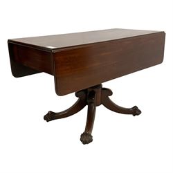 Victorian mahogany Pembroke supper table, fitted with single drawer, drop-leaf top on turned pedestal, four splayed supports with large carved paw feet on castors