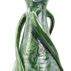 C.H. Brannam Barnstaple art pottery vase, baluster form, with three twisted scroll handles, incised with birds amongst flowers in blue green glaze, incised marks, dated 1905, H53cm