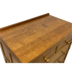 Mouseman - oak chest, raised back over adzed rectangular canted top, fitted with two short over four long graduating drawers, raised on octagonal and block feet, carved with mouse signature, by the workshop of Robert Thompson