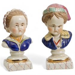 Pair of Staffordshire style busts of a young girl an boy, each upon square marbled bases, H22cm