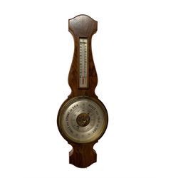 20th century aneroid barometer in a walnut veneered case.