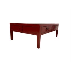 Chinese design red lacquered coffee table, rectangular form on square tapering supports, fitted with two drawers 