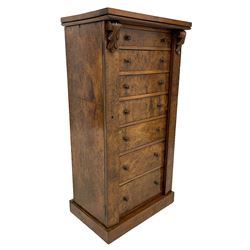 Victorian burr walnut Wellington chest, rectangular top with book-matched veneers, two hinged uprights with scrolled foliage carved brackets enclosing seven graduating drawers, on plinth base 