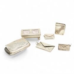 Silver trough shape double stamp box W5.5cm, three silver envelope design stamp boxes and two other small silver boxes (6) 