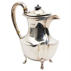 Silver oval teapot with ebonised lift, ivory insulators, loop handle and raised on four shaped supports and matching hot water jug Sheffield 1922/3 Maker Fenton Bros. Ltd. This item has been registered for sale under Section 10 of the APHA Ivory Act