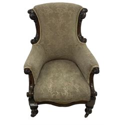 William IV mahogany framed armchair, rolled back with scroll carved uprights, acanthus carved arm terminals over serpentine fronted seat, raised on turned and lobe carved supports with castors