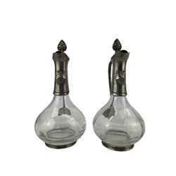 Pair of French glass and pewter mounted claret jugs, each with grapevine relief decoration, by Etain, H28cm 