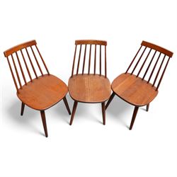 Set of three mid-20th century Swedish teak stick-back chairs, raised on tapering supports