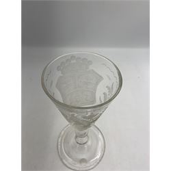 18th century large baluster wine glass, circa 1745, the funnel bowl decorated with a crest and foliate, to a knopped stem and deep domed  and upturned foot, H20cm