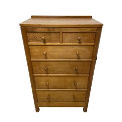 Mouseman - oak chest, raised back over adzed rectangular canted top, fitted with two short over four long graduating drawers, raised on octagonal and block feet, carved with mouse signature, by the workshop of Robert Thompson