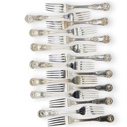 A matched set of 19th century silver Kings pattern cutlery comprising six table spoons, ten table forks, twelve dessert spoons, fish slice, pair of sauce ladles, ten teaspoons, six fish knives, seven silver handled knives, two salt spoons  and fifteen dessert forks, various dates and makers 